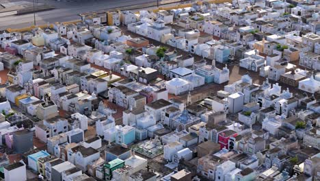 Small-tombstone-homes-in-cemetery-organized-in-clean-rows-of-crypts-in-Curacao