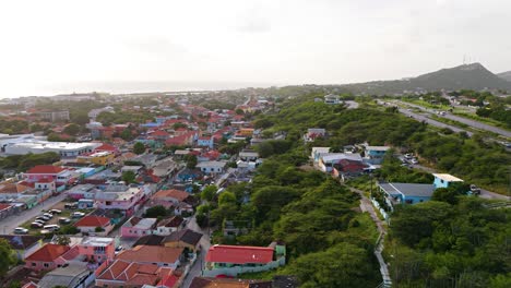 Golden-hour-light-spread-across-hillside-overlooking-Otrobanda-Curacao-colorful-homes-neighborhood