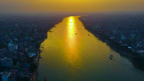 Aerial-of-the-riverside-urbanization,-Buriganga-river-along-the-city,-Dhaka,-Bangladesh