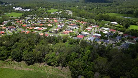 Right-to-left-aerial-over-residential-housing,-Mudgeeraba,-Gold-Coast,-Queensland,-Australia