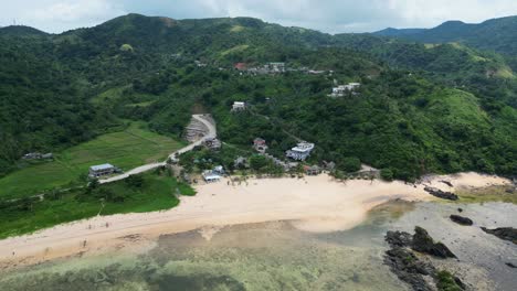 Puraran-beach-in-baras-with-lush-greenery-and-sandy-shores,-aerial-view