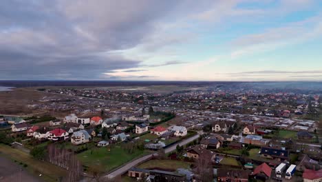 Drone-shot-of-scenic-town-of-Lithuania-at-sunset,-Silute,-Europe
