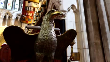 Low-angle-shot-of-a-golden-eagle-statue-inside-of-St-Patrick's-Cathedral,-Dublin,-Ireland