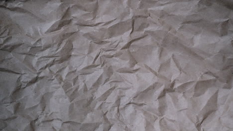 Stop-Motion:-Fast,-chaotic-crumpled-brown-paper-texture-for-documentary-background