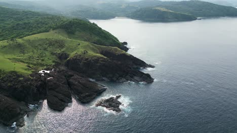 The-lush-baras-landscapes-in-catanduanes-with-rocky-coastline-and-ocean,-aerial-view