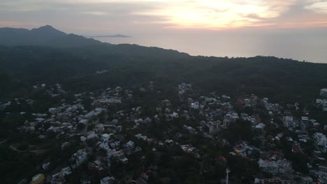 Aerial-Drone-Fly-Above-Sayulita-Mexican-Village,-Sierra-Madre-Mountain-Landscape