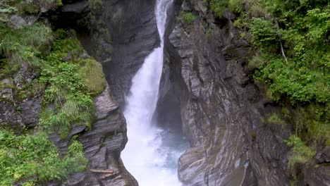 The-Stieber-waterfall-steaming-between-rocks,-Passeier-valley,-South-Tyrol,-Italy