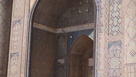 tiled-archway-of-an-ancient-madrassa-school-of-islamic-thought-in-Samarkand,-Uzbekistan-along-the-historic-Silk-Road