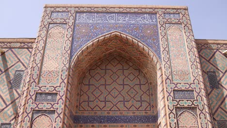 intricate-tiling-around-ancient-mosque-in-Registan-square-in-Samarkand,-Uzbekistan-along-the-historic-Silk-Road