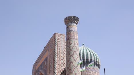 beautiful-blue-domes-on-fascade-of-madrassa-in-Samarkand,-Uzbekistan-along-the-historic-Silk-Road