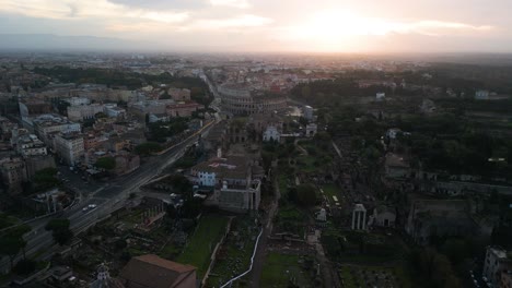 Aerial-View-Above-Roman-Forum,-Ancient-Colosseum-in-Background
