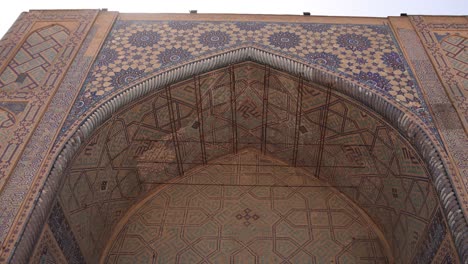 top-of-an-archway-in-ancient-mosque-in-Registan-Square-in-Samarkand,-Uzbekistan-along-the-historic-Silk-Road