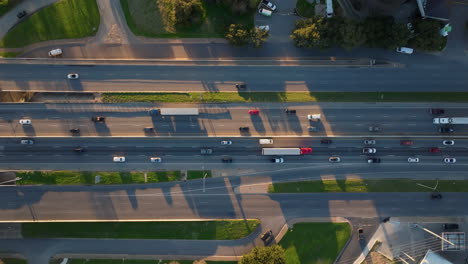 Aerial-of-highway-traffic-with-cars-and-lorry's-slowing-down-in-congested-area-on-multilane-freeway