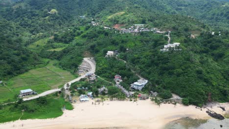 Puraran-baras-with-lush-greenery-and-a-sandy-beach,-aerial-view