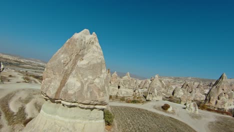 Valleys-And-Fairy-Chimney-With-A-Person-Horseback-Riding-In-Cappadocia,-Turkey