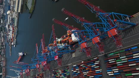 Commercial-port-of-Hamburg,-Hamburg,-Germany,-Circling-Top-Down-Drone