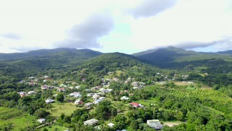 Township-of-Bailif-in-jungle-and-mountains-of-Guadeloupe,-aerial-view