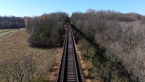 Aerial-Shot-Pushing-Forwards-Along-the-Pope-Lick-Trestle-Railroad-Tracks-on-a-Sunny-Afternoon-in-Louisville-Kentucky