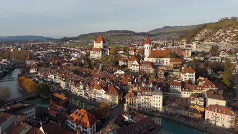 Picturesque-historical-Thun-town-and-river-Aare-flowing-in-center