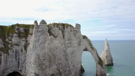 Flying-around-the-rocky-arch-of-Etretat-in-France-on-the-coast-of-Normandy