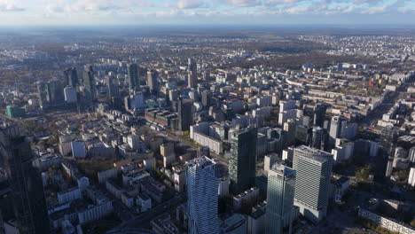Wide-aerial-shot-of-large-skyscrapers-and-block-housing-Warsaw-Poland