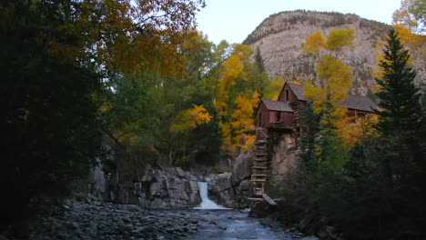 Sunset-golden-hour-Colorado-Crystal-Mill-building-historic-landmark-waterfall-Crystal-River-Marble-sunset-autumn-fall-aerial-drone-cinematic-Carbondale-Telluride-Aspen-Gunnison-county-forward-slowly