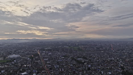 Bogota-Colombia-Aerial-v14-panoramic-view-drone-flyover-Barrios-Unidos,-Quinta-Mutis-and-Teusaquillo-capturing-sunset-cityscape-featuring-arena-and-stadium---Shot-with-Mavic-3-Cine---November-2022