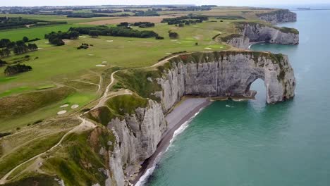 Flying-high-above-the-rocky-arch-of-Etretat-on-the-coast-of-France