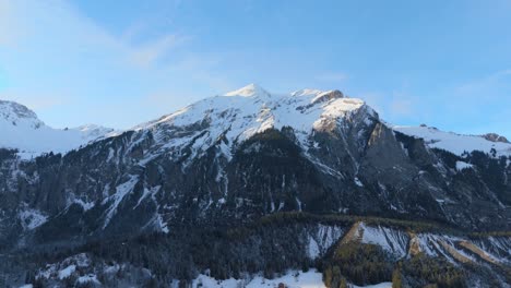 Breathtaking-panorama-of-snowy-peaks-in-Alps-mountains-below-blue-sky