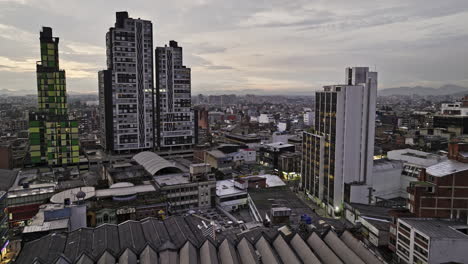 Bogota-Colombia-Aerial-v18-establishing-drone-flyover-Chapinero-neighborhood-capturing-dusk-cityscape-with-a-mix-of-historic-buildings-and-modern-architectures---Shot-with-Mavic-3-Cine---November-2022