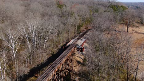 Tight-Aerial-Shot-of-Railroad-Tracks-Running-Out-of-the-Forest-and-on-to-the-Pope-Lick-Trestle-in-Louisville-Kentucky