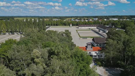 Dachau-Concentration-Camp,-Munich,-Germany,-Wide-Establishing-Drone,-Summer,-Sunny-Day,-Beautiful-Cloudscape