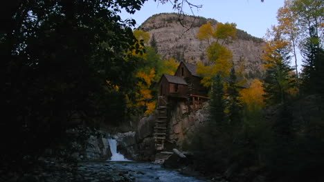 Sunset-golden-hour-Colorado-Crystal-Mill-building-historic-landmark-waterfall-Crystal-River-Marble-sunset-autumn-fall-aerial-drone-cinematic-Carbondale-Telluride-Aspen-Gunnison-county-right-reveal