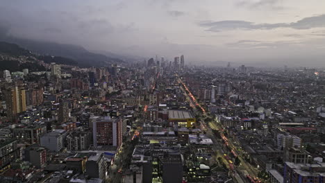 Bogota-Colombia-Aerial-v20-drone-flyover-Marly-neighborhood-towards-Chapinero-and-Teusaquillo-along-Avenida-Caracas-capturing-downtown-cityscape-on-the-skyline---Shot-with-Mavic-3-Cine---November-2022