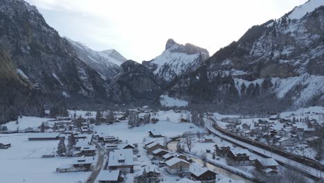 High-Swiss-alps-mountains-looming-over-Kandersteg-town-in-winter-snow