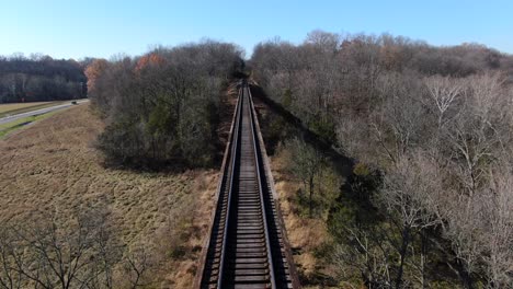 Aerial-Shot-Pushing-Forwards-Along-the-Pope-Lick-Trestle-Railroad-Tracks-on-a-Sunny-Afternoon-in-Louisville-Kentucky