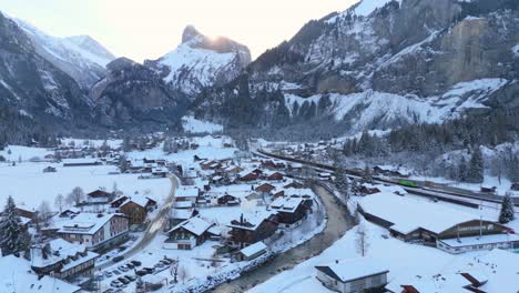 Picturesque-town-in-mountain-valley-below-the-Alps-in-winter-snow