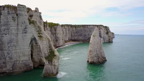 Flying-close-to-the-rocky-arch-of-Etretat-of-the-coastline-of-Normandy-in-France