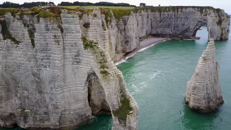Flying-around-the-Etretat-close-to-the-rocky-side,-of-France