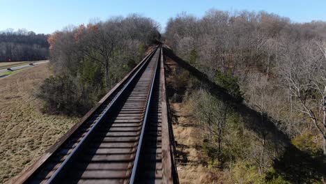 Aerial-Shot-Pushing-Forward-Over-the-Tracks-of-the-Pope-Lick-Railroad-Trestle-in-Louisville-Kentucky-on-a-Sunny-Winter-Day