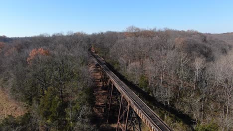 Aerial-Shot-Pulling-Away-From-the-End-of-the-Pope-Lick-Railroad-Trestle-Where-the-Tracks-Curve-into-the-Forest-in-Louisville-Kentucky