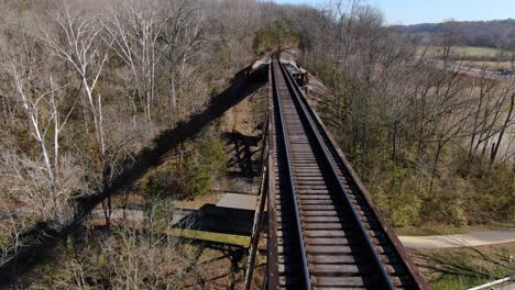 Aerial-Shot-Pushing-Forward-Along-the-Tracks-of-the-Pope-Lick-Railroad-Trestle-in-Louisville-Kentucky-on-a-Sunny-Winter-Day