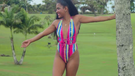 A-woman-in-a-captivating-bikini-finds-pleasure-in-a-Trinidadian-Caribbean-field