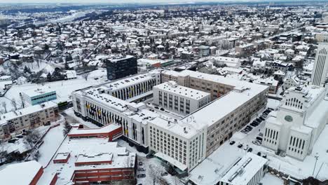 Aerial-view-of-the-first-stage-of-Radio-City-in-Kaunas,-Lithuania,-snow-covered-winter-landscape