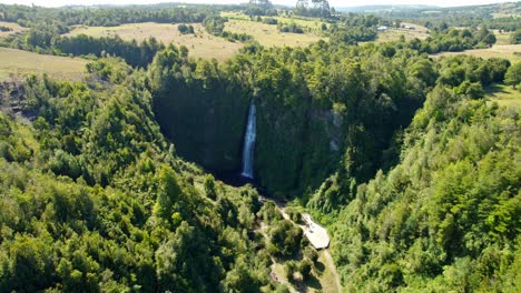 Aerial-view-circling-the-Cascadas-de-Tocoihue-waterfall,-in-sunny-Chiloe,-Chile