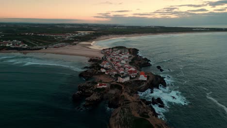 drone-shot-over-Baleal-Island-near-Peniche-in-Oeste-region,-Portugal-at-sunset