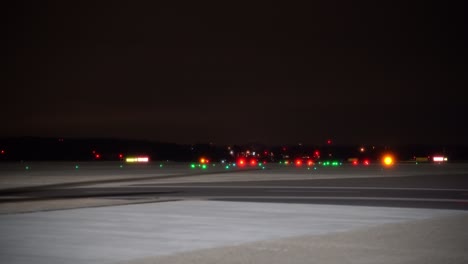 Airport-runway-illuminated-by-series-of-precisely-positioned-lights