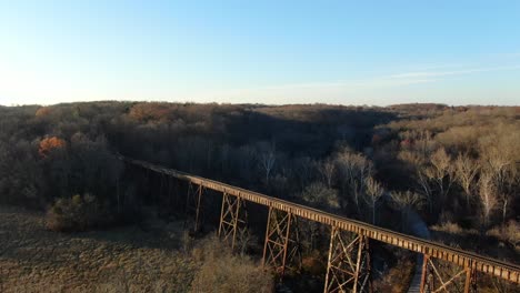 Aerial-Shot-Pushing-Forward-and-Panning-Down-to-the-Pope-Lick-Railroad-Trestle-in-Louisville-Kentucky-at-Sunset