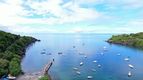 Many-boats-moored-near-tropical-coastline-of-Guadeloupe,-aerial-view
