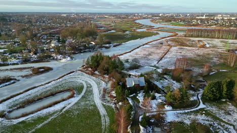 Aerial-view-of-snow-dusted-Jelgava-landscape,-Latvia